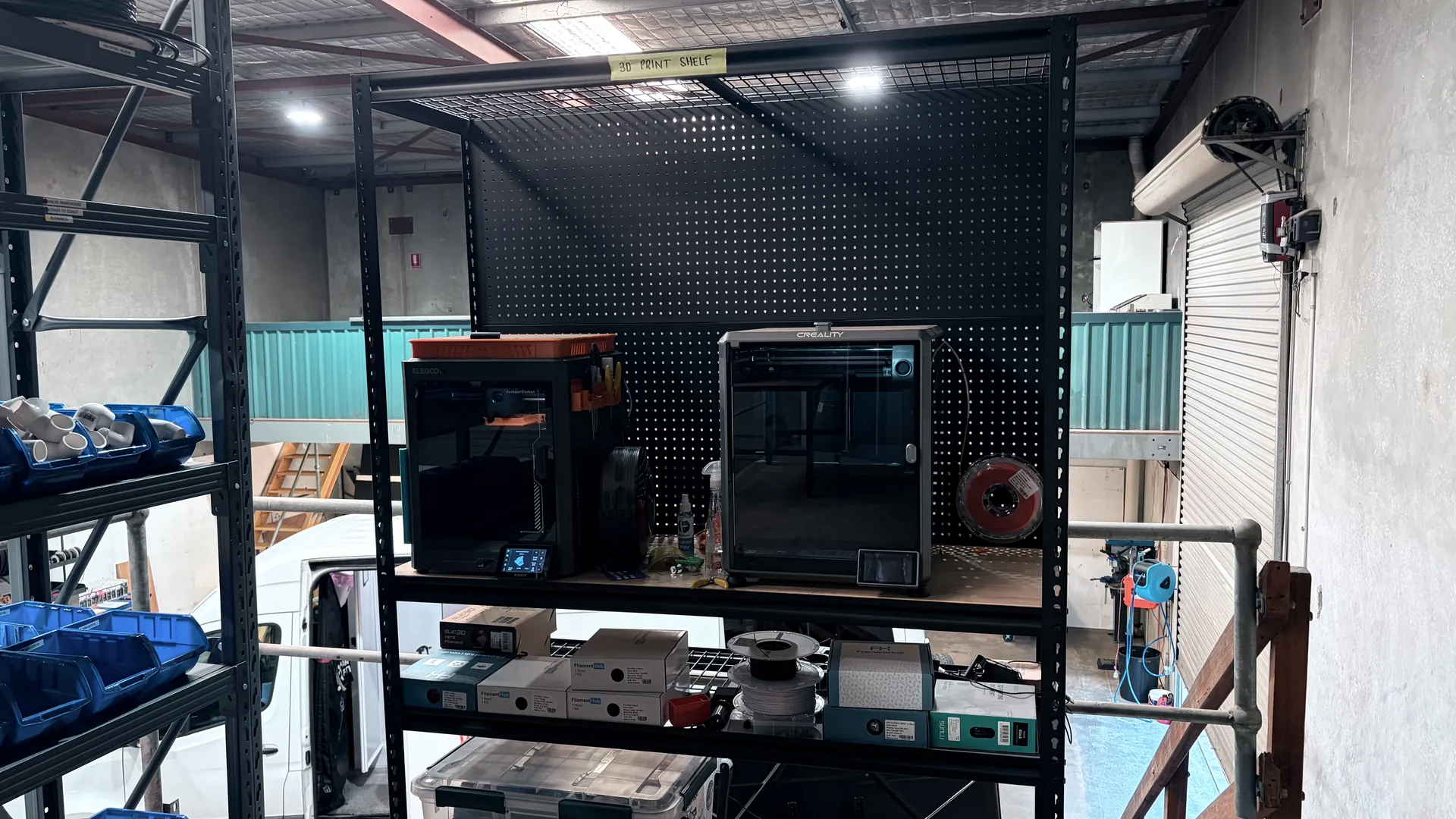 3D printers running in the Apex workshop alongside tooling and printed parts